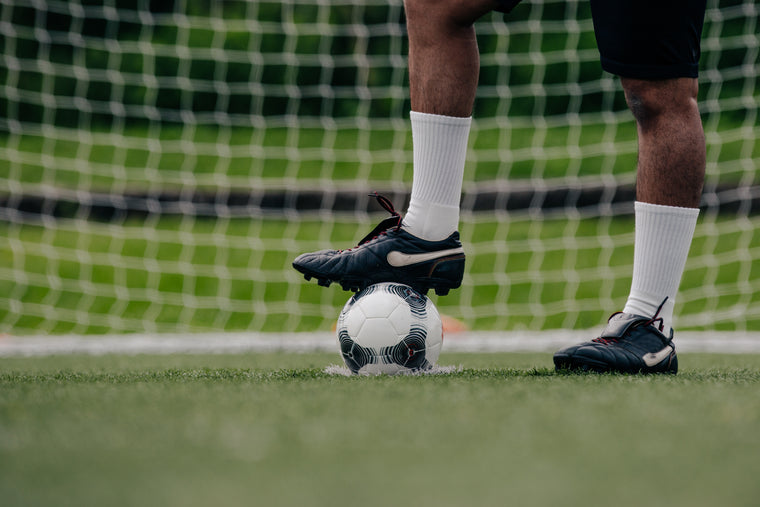 cleats-on-soccer-ball